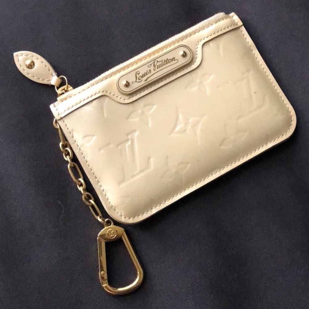 Authentic Louis Vuitton clef coin purse in ivory